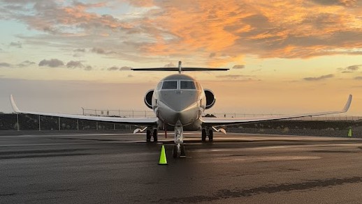 Private jet facing the sunset on the Kona ramp